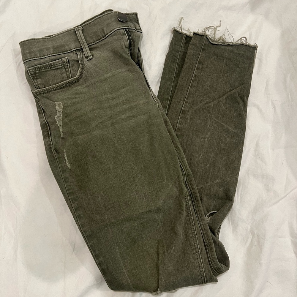 Express distressed olive green skinny jeans